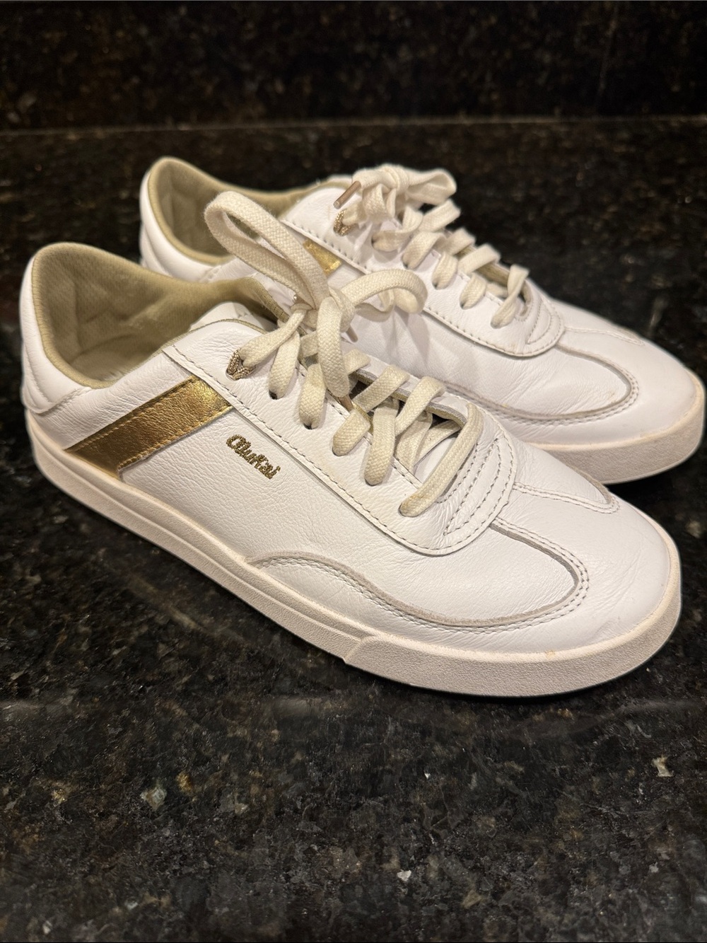 OluKai White Sneakers with Gold Accents
